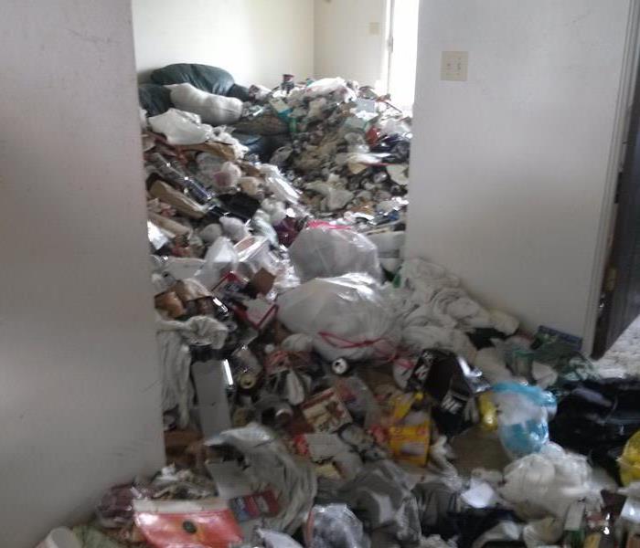 Piles of garbage in a hoarder's house in Spokane