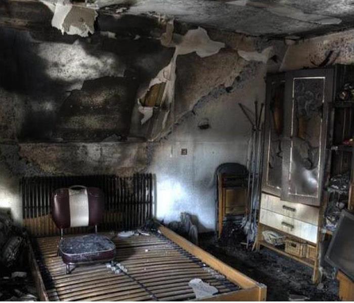 Bedroom with major fire damage