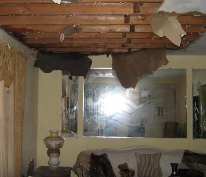 exposed beams from water damaged ceiling